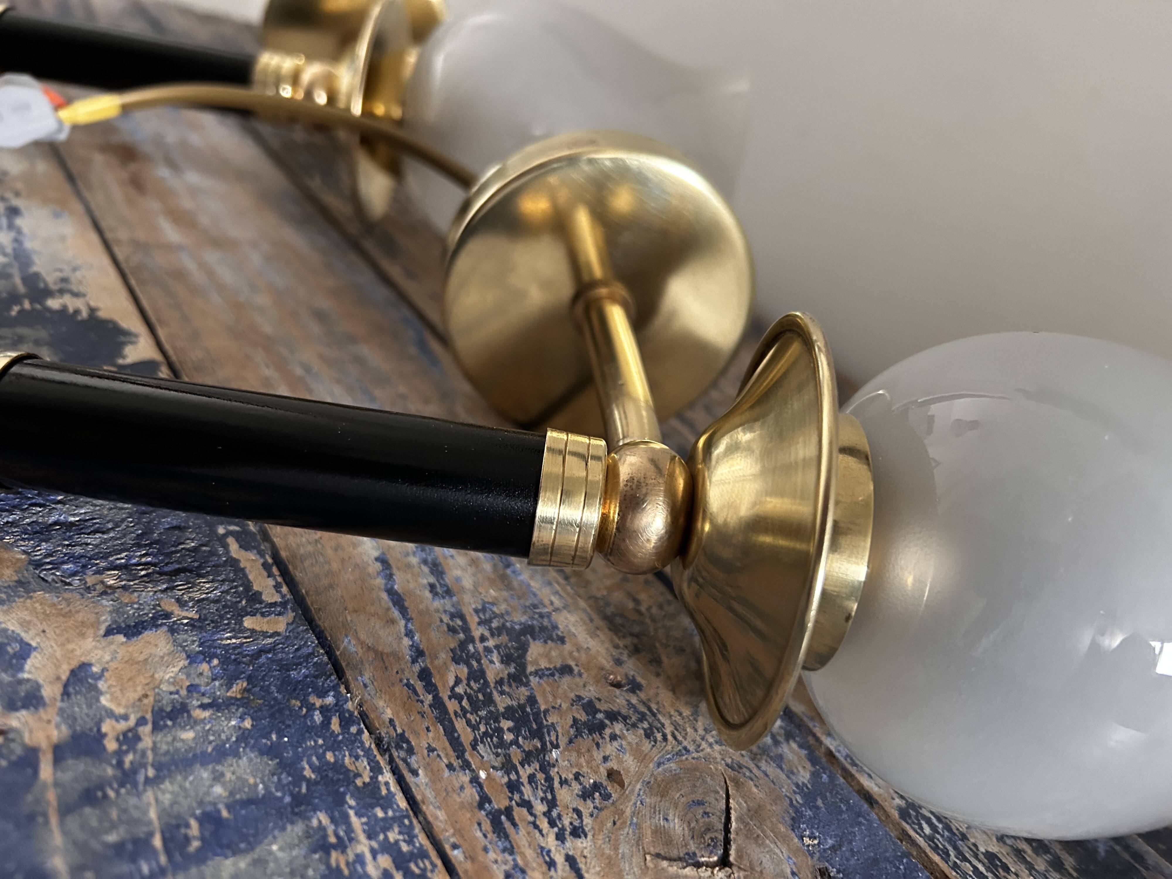Pair of brass and black torchiere wall lights