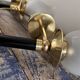 Pair of brass and black torchiere wall lights