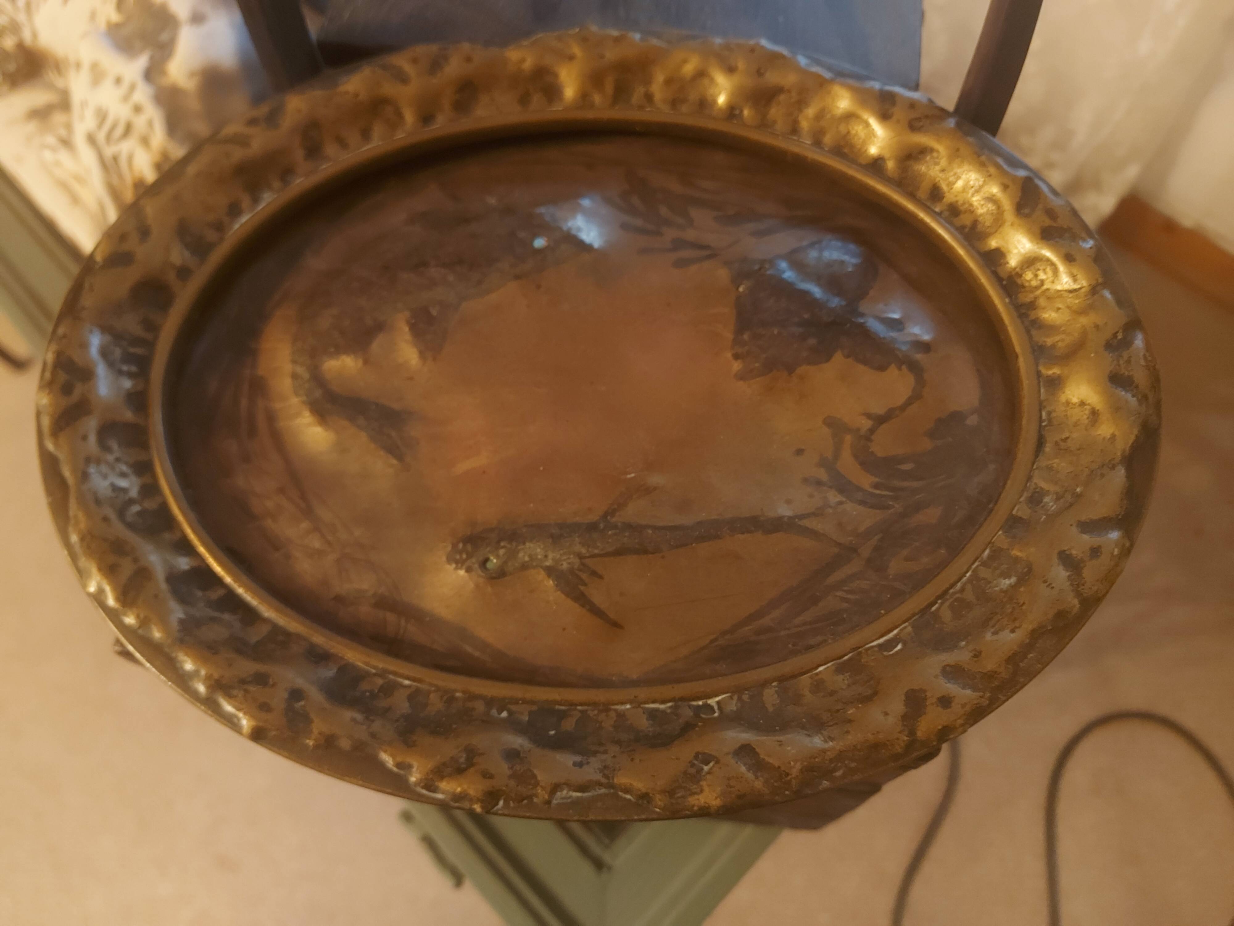 Decorative copper repoussé plate with marine motifs