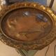 Decorative copper repoussé plate with marine motifs
