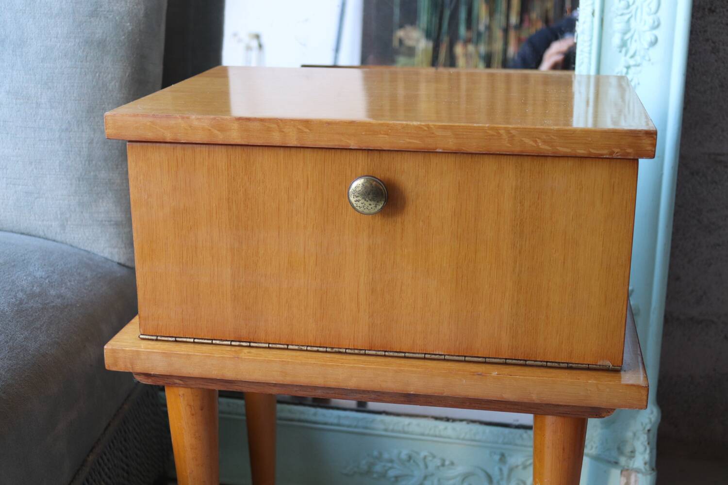 Modernist bedside table from the 1950s with compass legs.