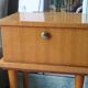 Modernist bedside table from the 1950s with compass legs.
