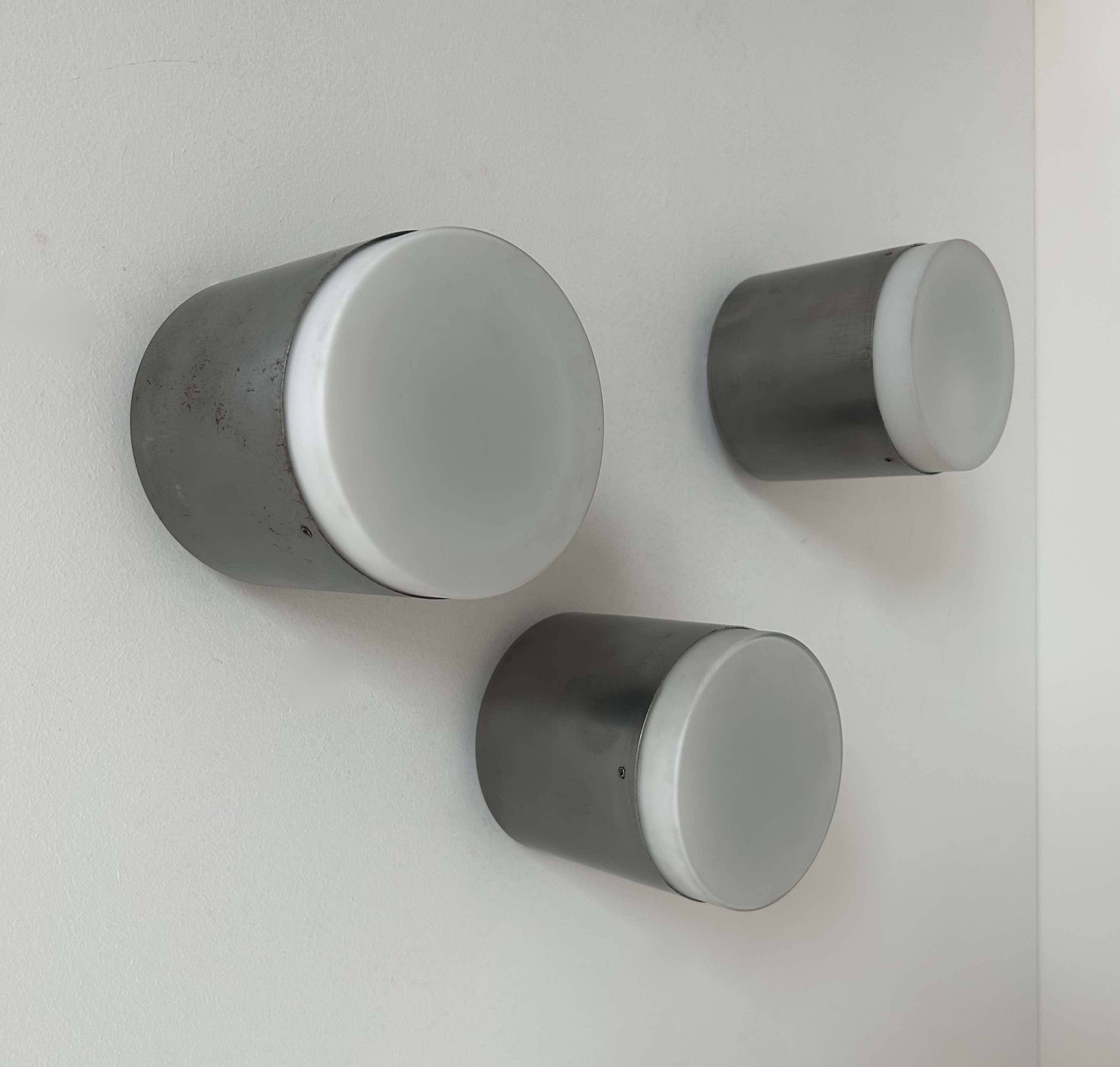Set of 3 vintage Raak wall lights, aluminum and opaline, Holland 1960