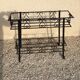 Wrought iron pot-carrying planter