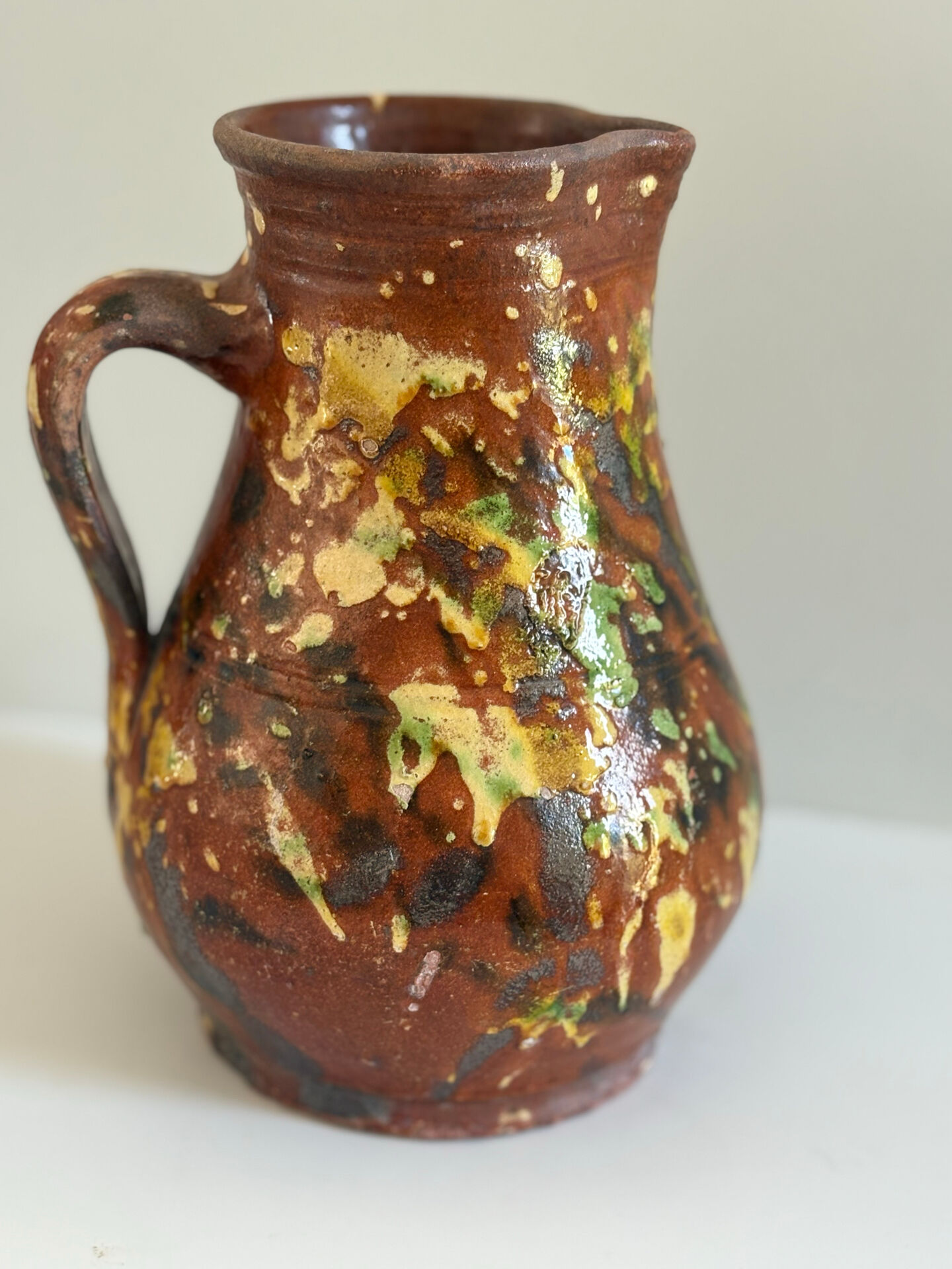 Studio ceramic pitcher with sprayed glazes – circa 1960-70
