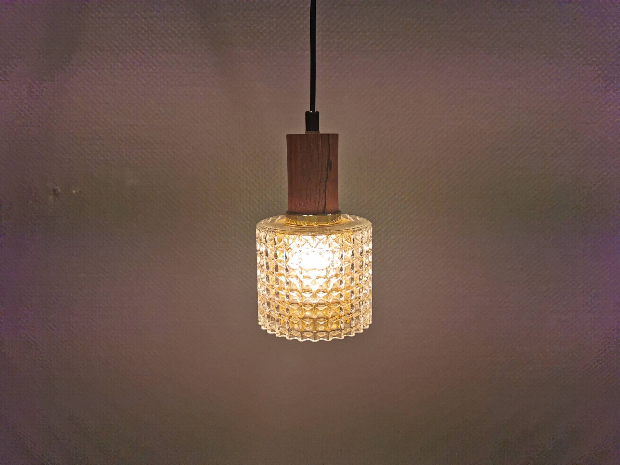 Older Swedish hanging lamp in multi-layered crystal glass with rosewood top and brass ring.