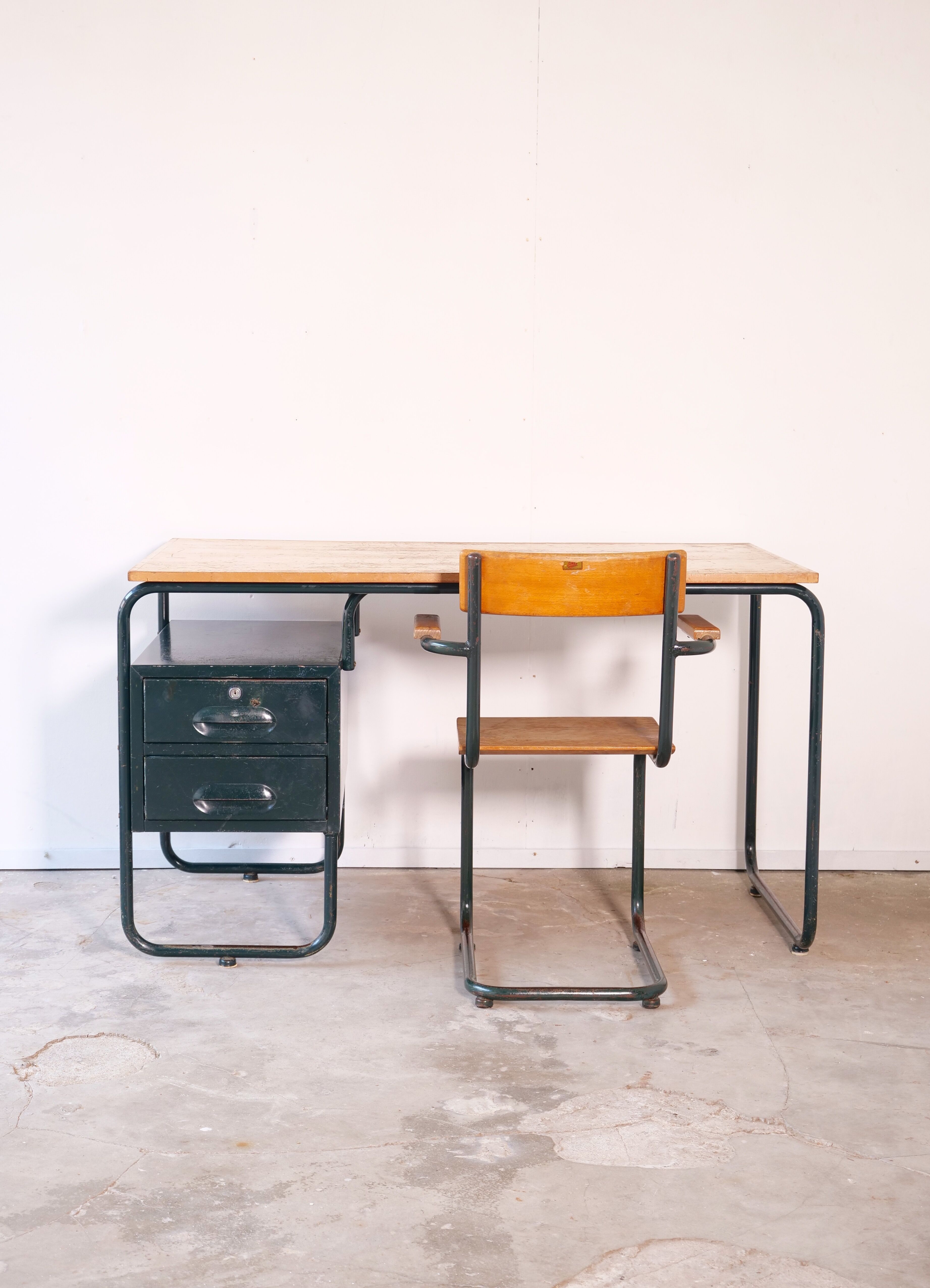 Desk with bauhaus style tubular steel chair
