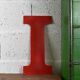 Industrial letter "I" in red metal