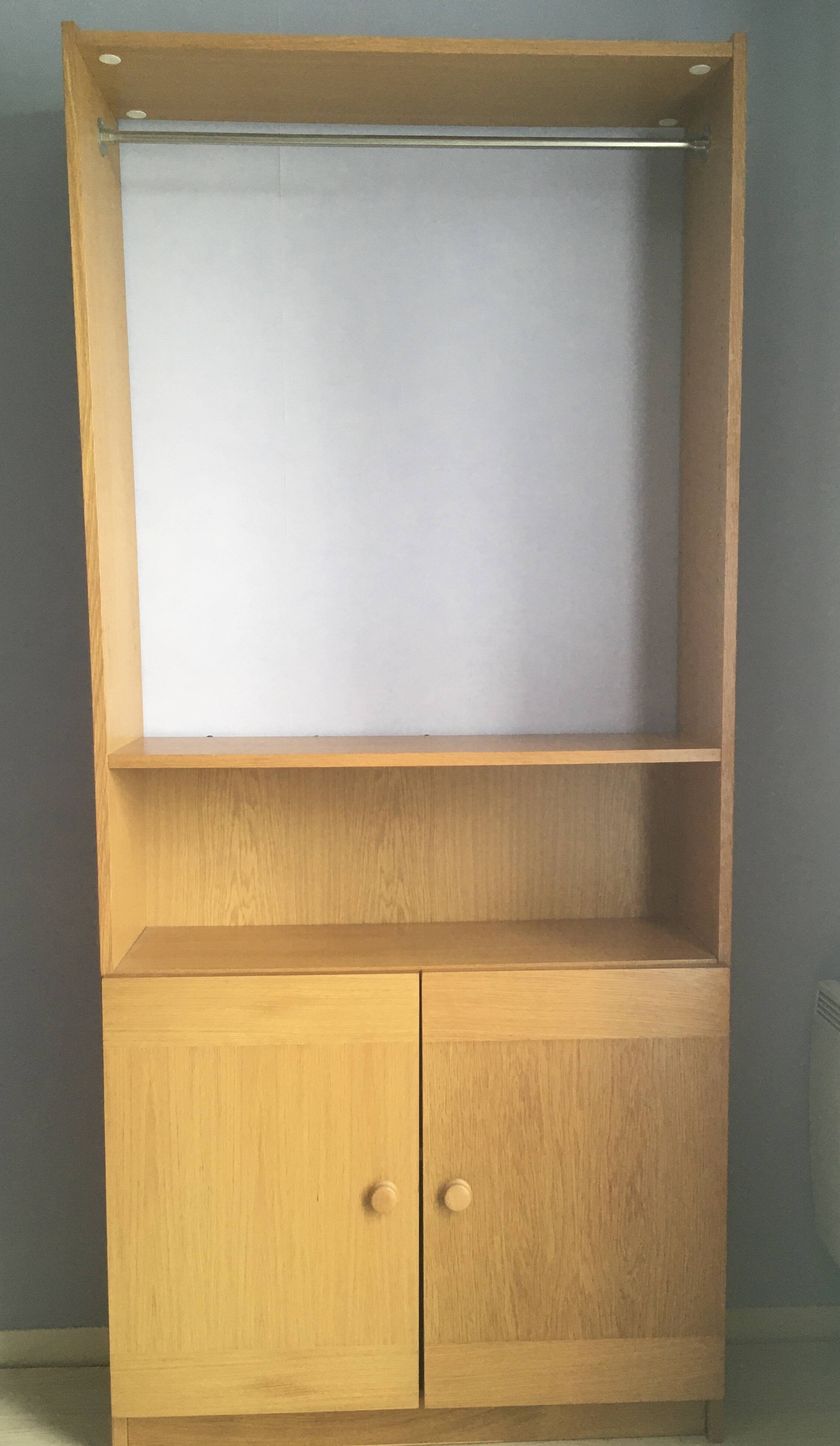 Dressing vintage Scandinavian style in light wood with wardrobe and cupboard.