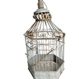 Vintage hexagonal metal birdcage from around 1940.