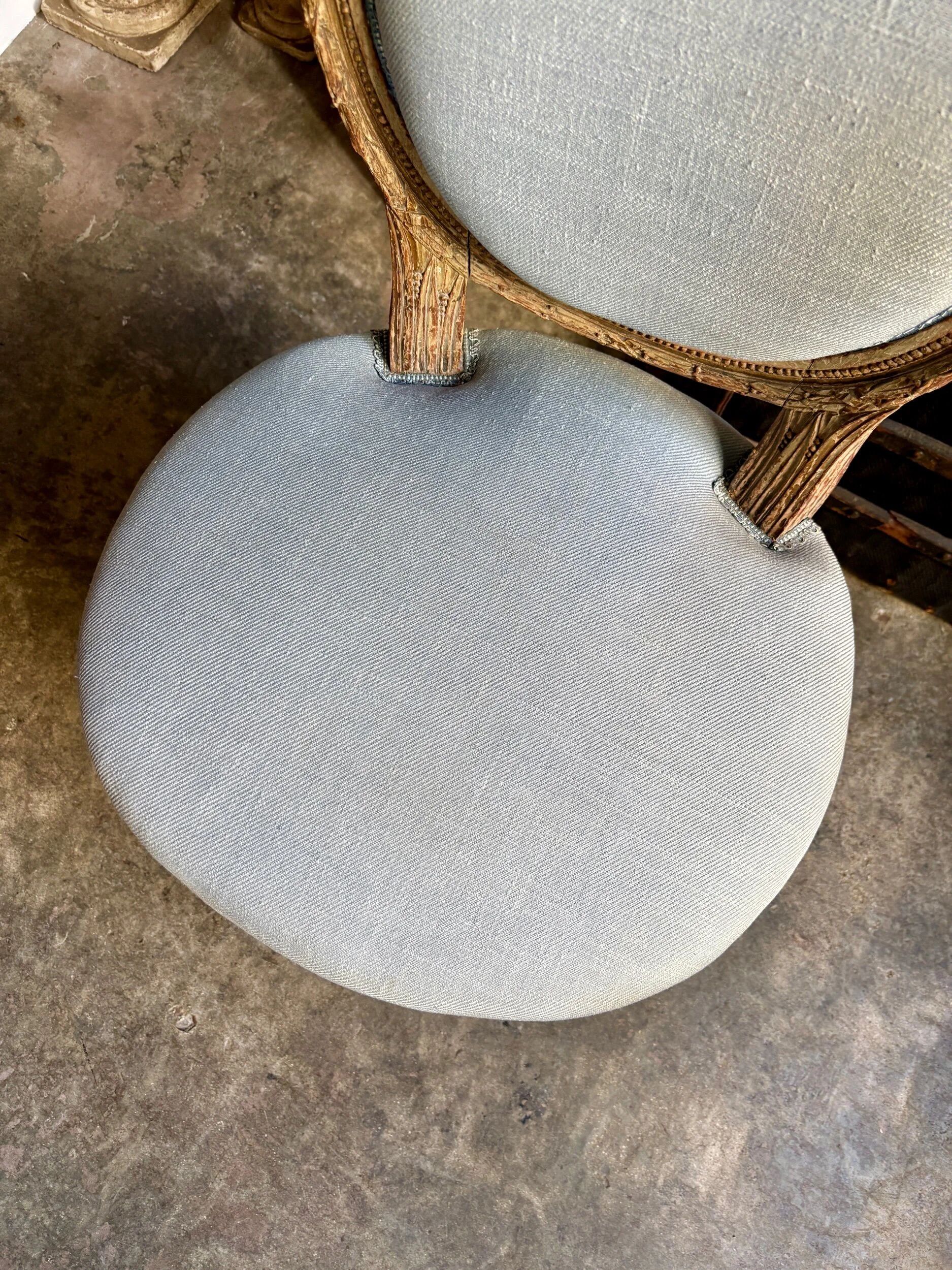 Medallion back chair in reclaimed wood and blue cotton.