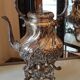 Ancient samovar tea fountain in silver metal