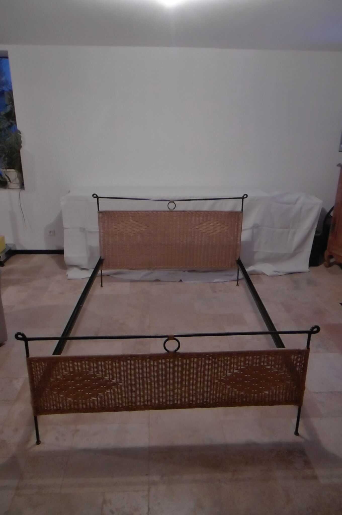 Black metal and rattan bed frame