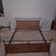 Black metal and rattan bed frame