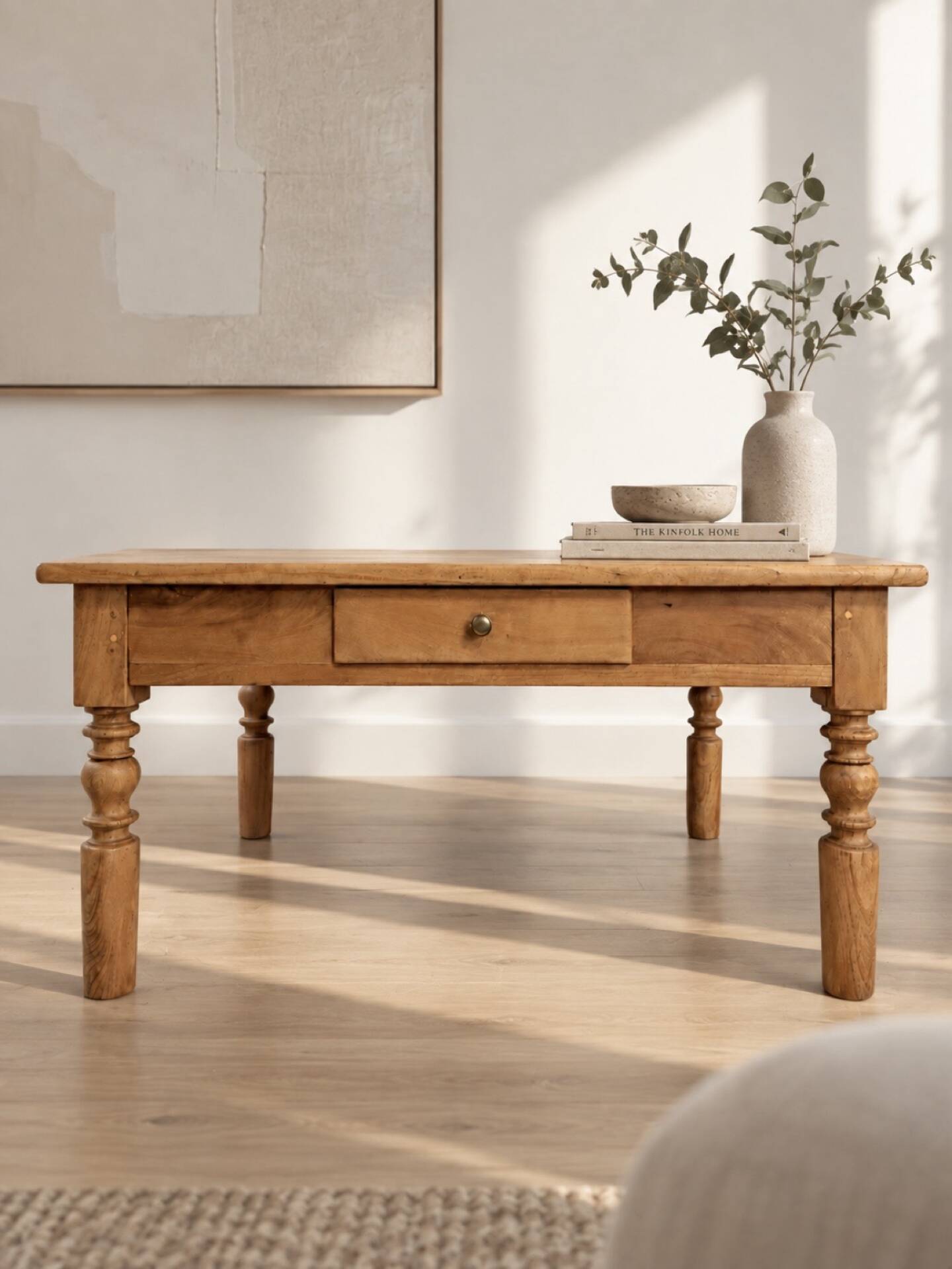 Antique coffee table in solid elm with turned legs.