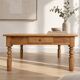 Antique coffee table in solid elm with turned legs.
