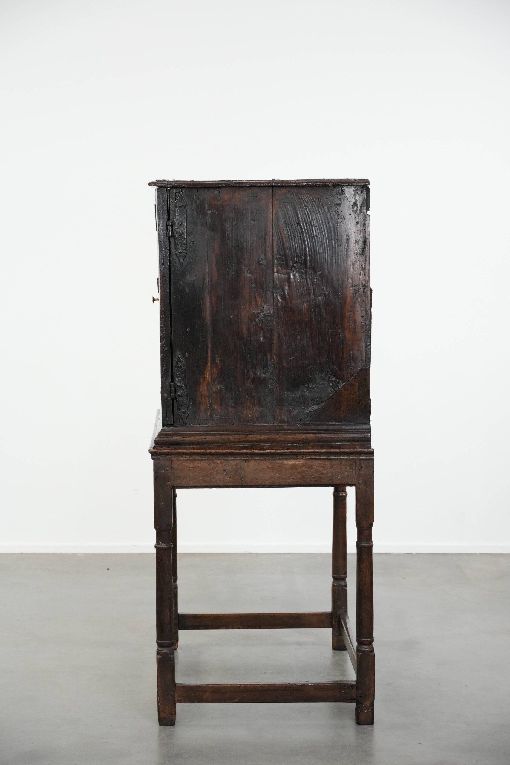 Unique antique English cabinet on stand made of oak from the 17th century