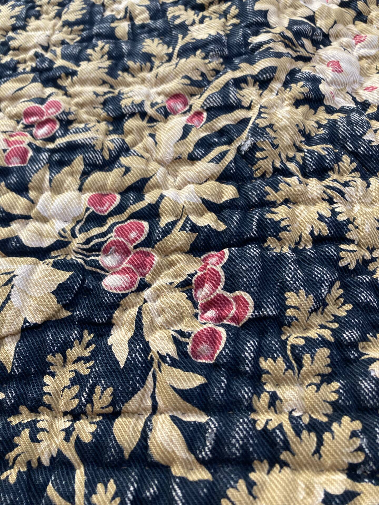Antique hand-stitched boutis bedspread, floral fabric, 19th century.