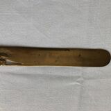 Opens carved bronze letters