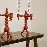 Pair of red wooden candelabra from Sweden 1970