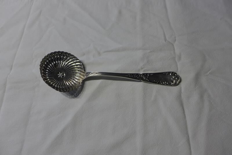Silver sprinkler spoon
