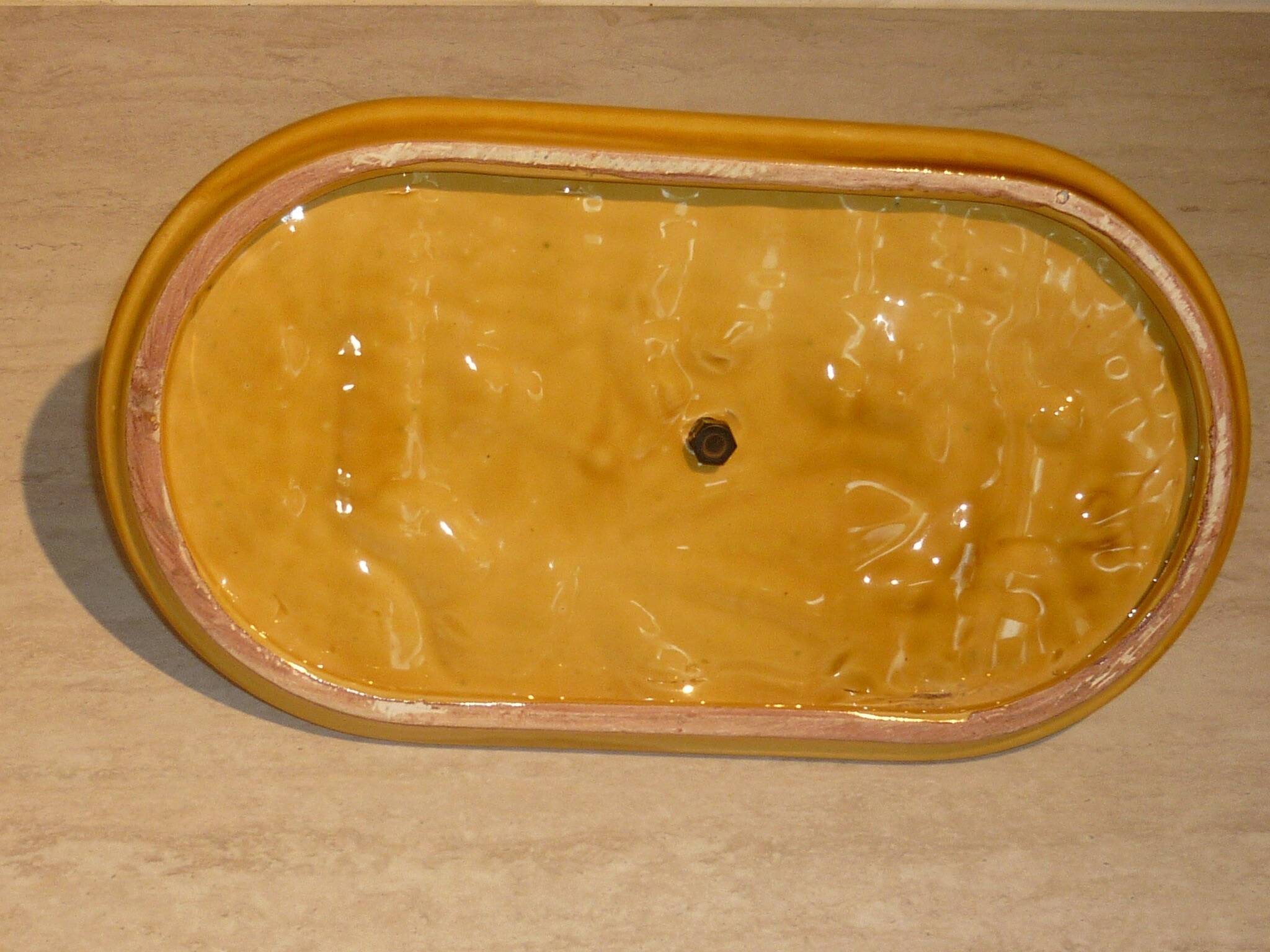 Braided yellow cheese platter and wrought iron