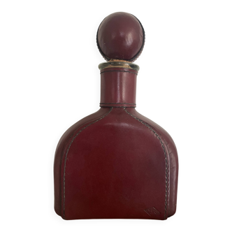 Carafe vintage glass bottle covered in leather
