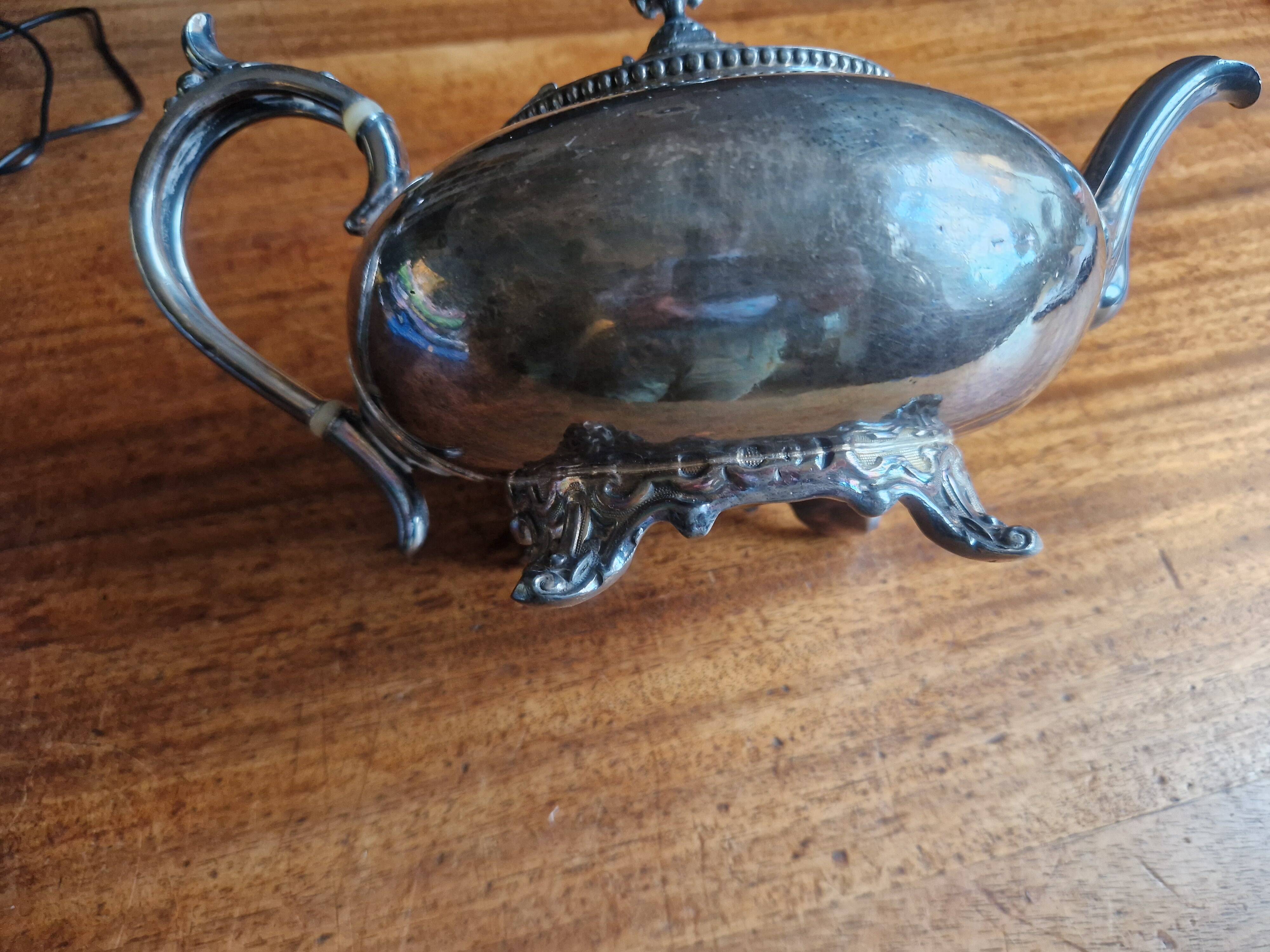 Silver-plated metal teapot in English style