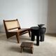 Black mango wood tripod side table with a semi-spherical top, height: 45 cm, diameter: 44 cm.