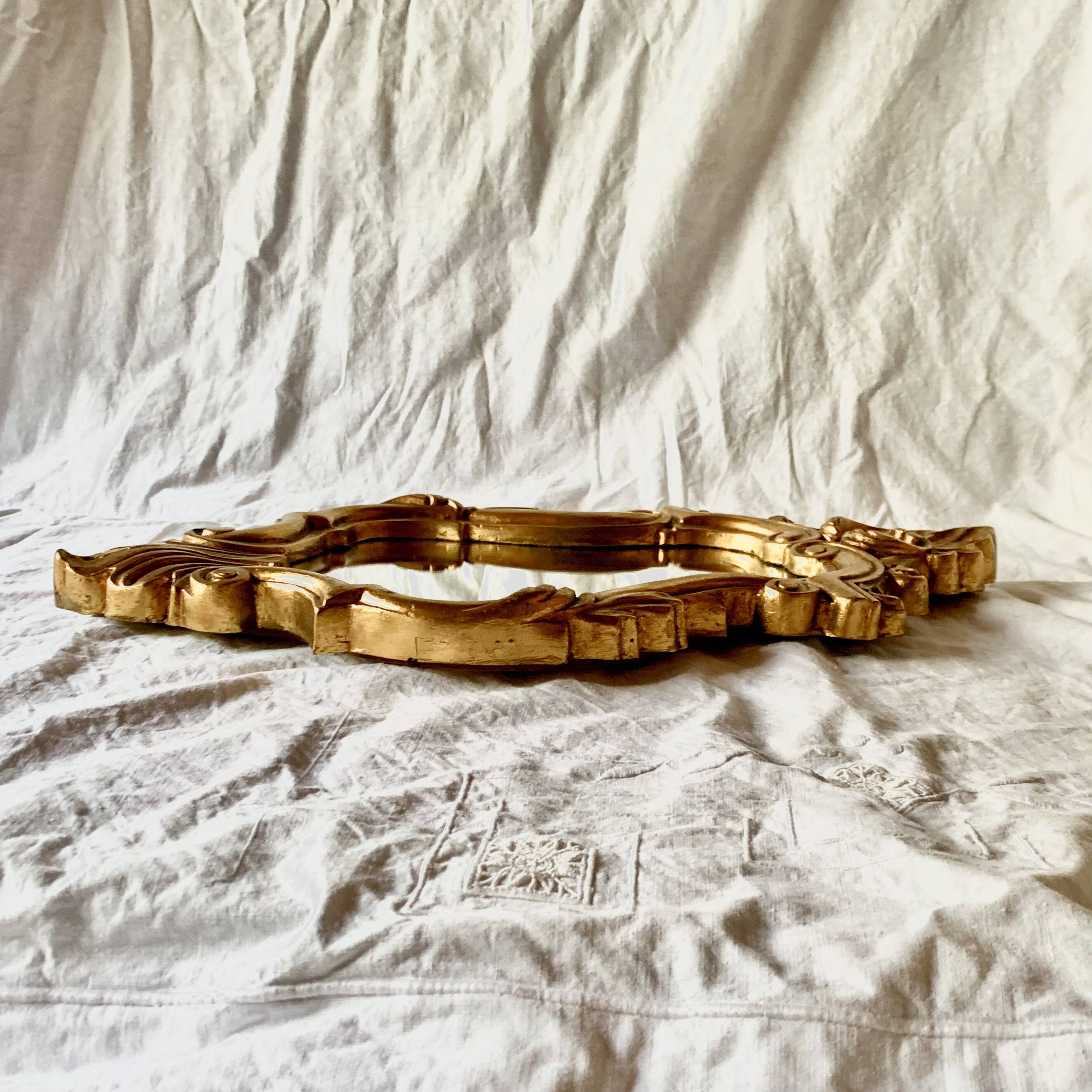 Antique wall mirror in gold leaf resin