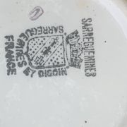 Milk jug, pitcher with white polka dots on orange earthenware, Sarreguemines and Digoin