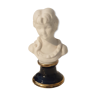 Biscuit bust on blue porcelain base of the oven