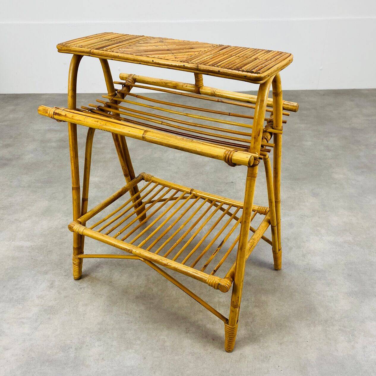 1960s rattan and bamboo coffee table, with its magazine rack.