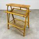 1960s rattan and bamboo coffee table, with its magazine rack.