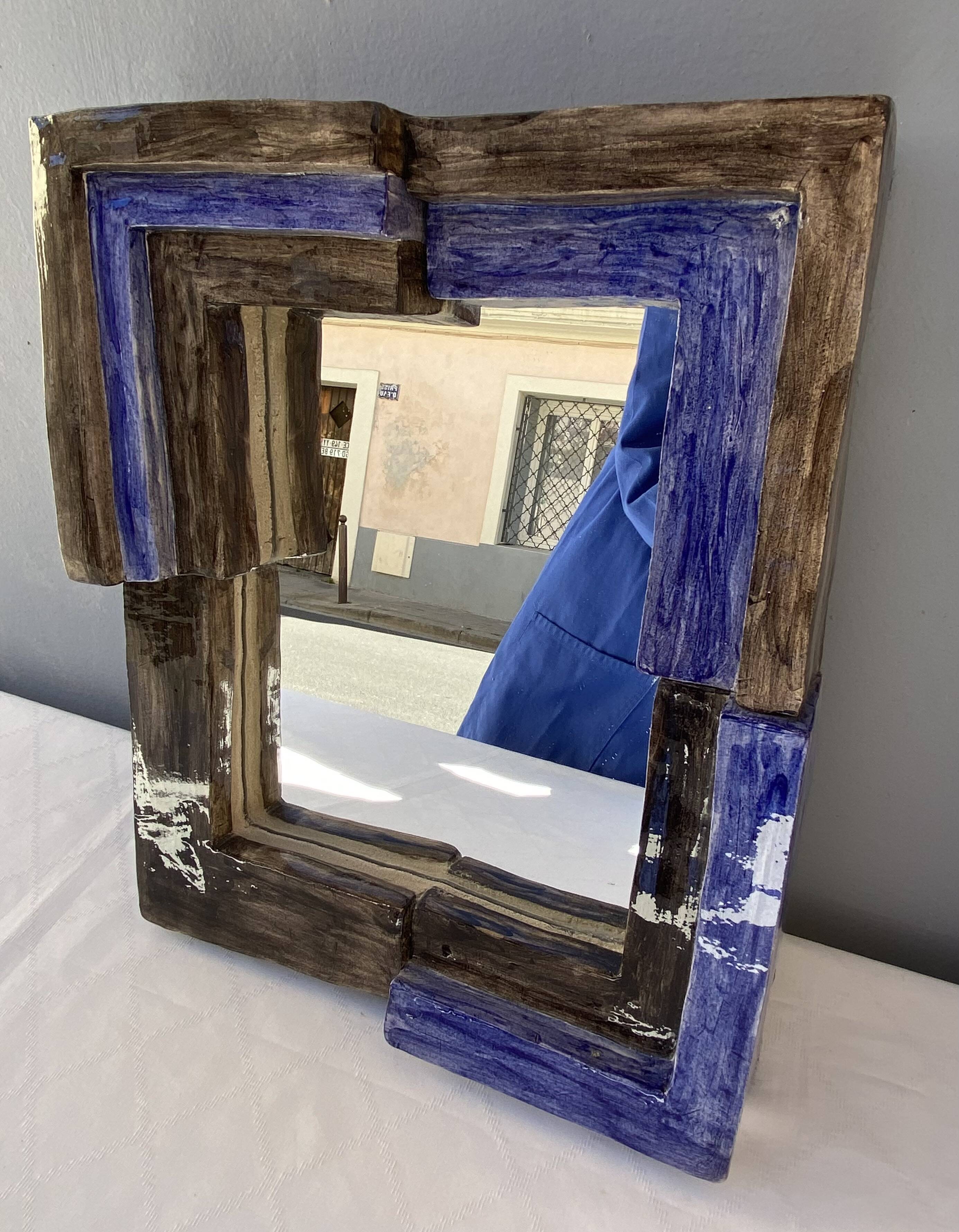 Mirror with ceramic frame