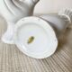 Pair of porcelain candle holders and bird vases