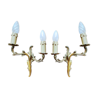 Pair of appliques with two arms of light with a leafy decoration