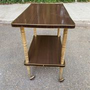 Double-tray rosewood serving trolley on gilded casters, 1970