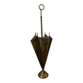 Vintage umbrella stand in gold and copper shaped like an umbrella.