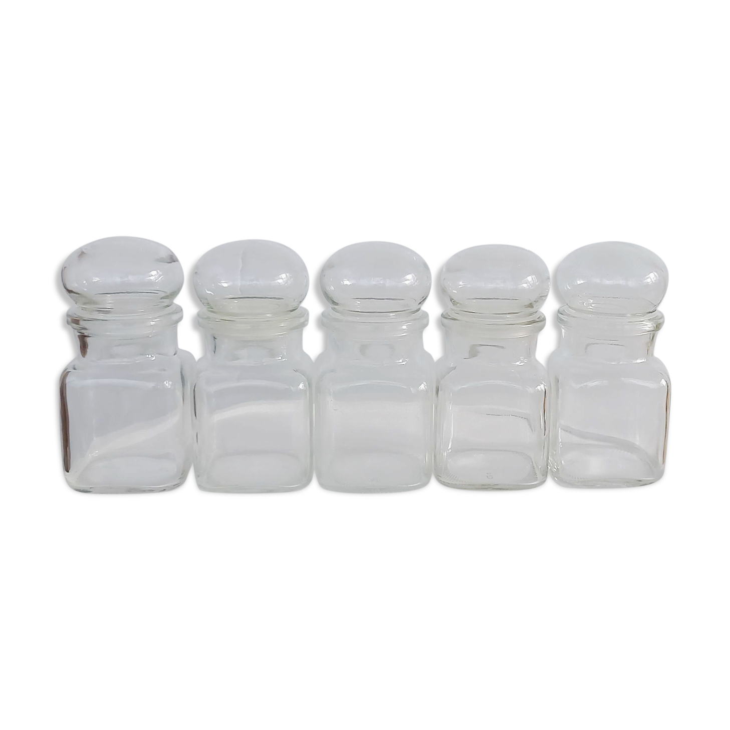 Set of five transparent glass apothecary jars