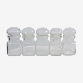 Set of five transparent glass apothecary jars