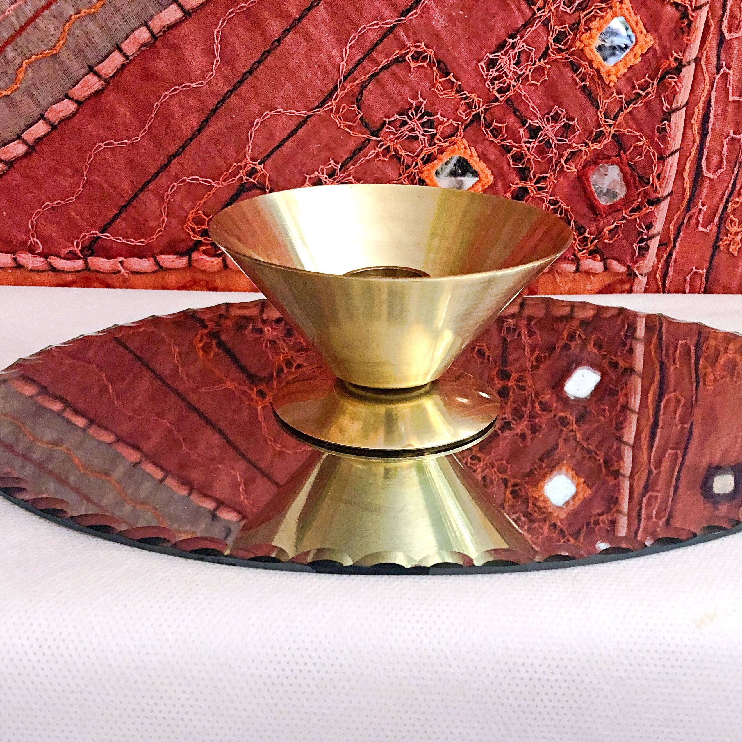 Table candle holder in golden brass