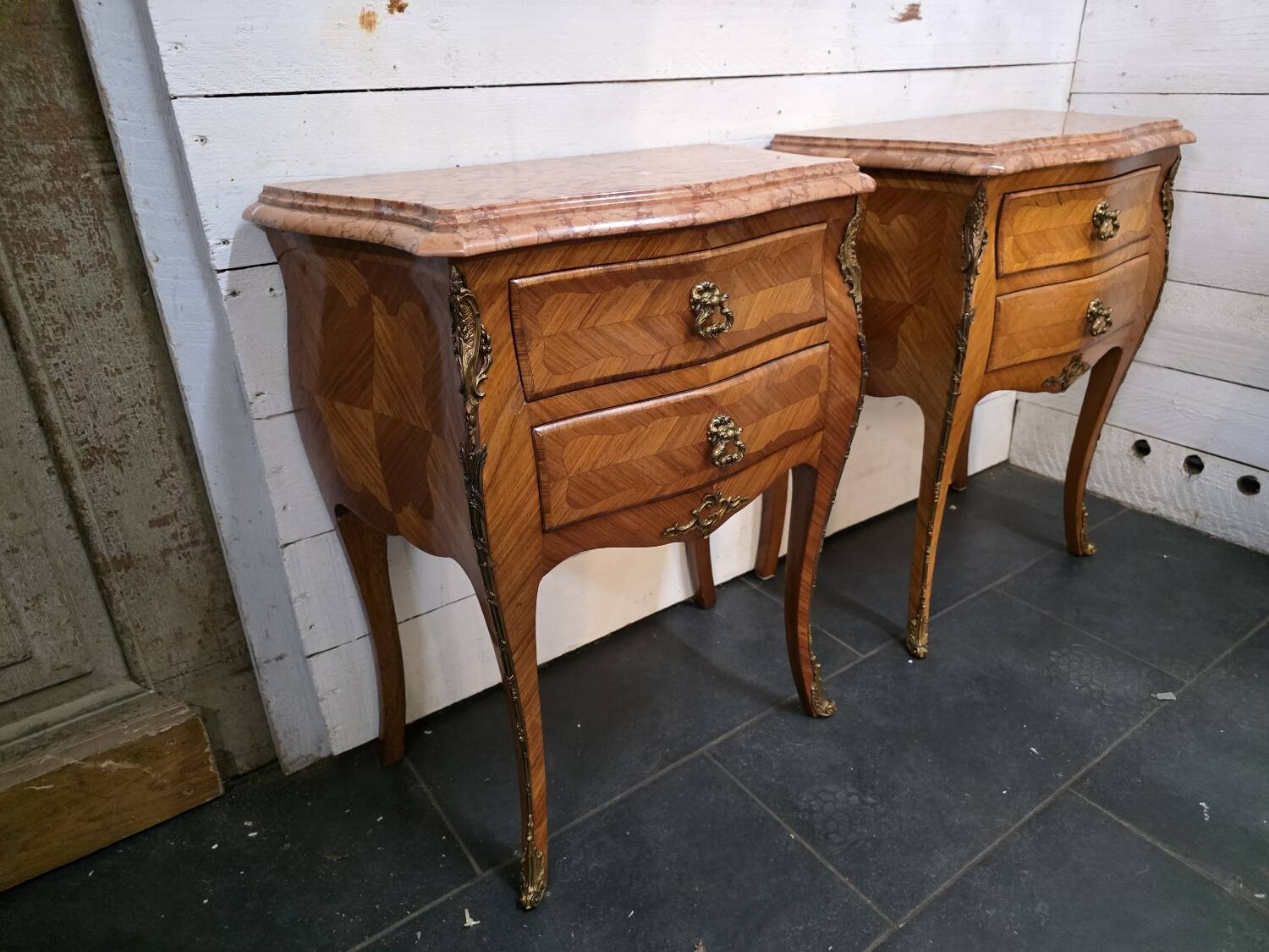 Pair of Louis XV style curved bedside tables in marquetry