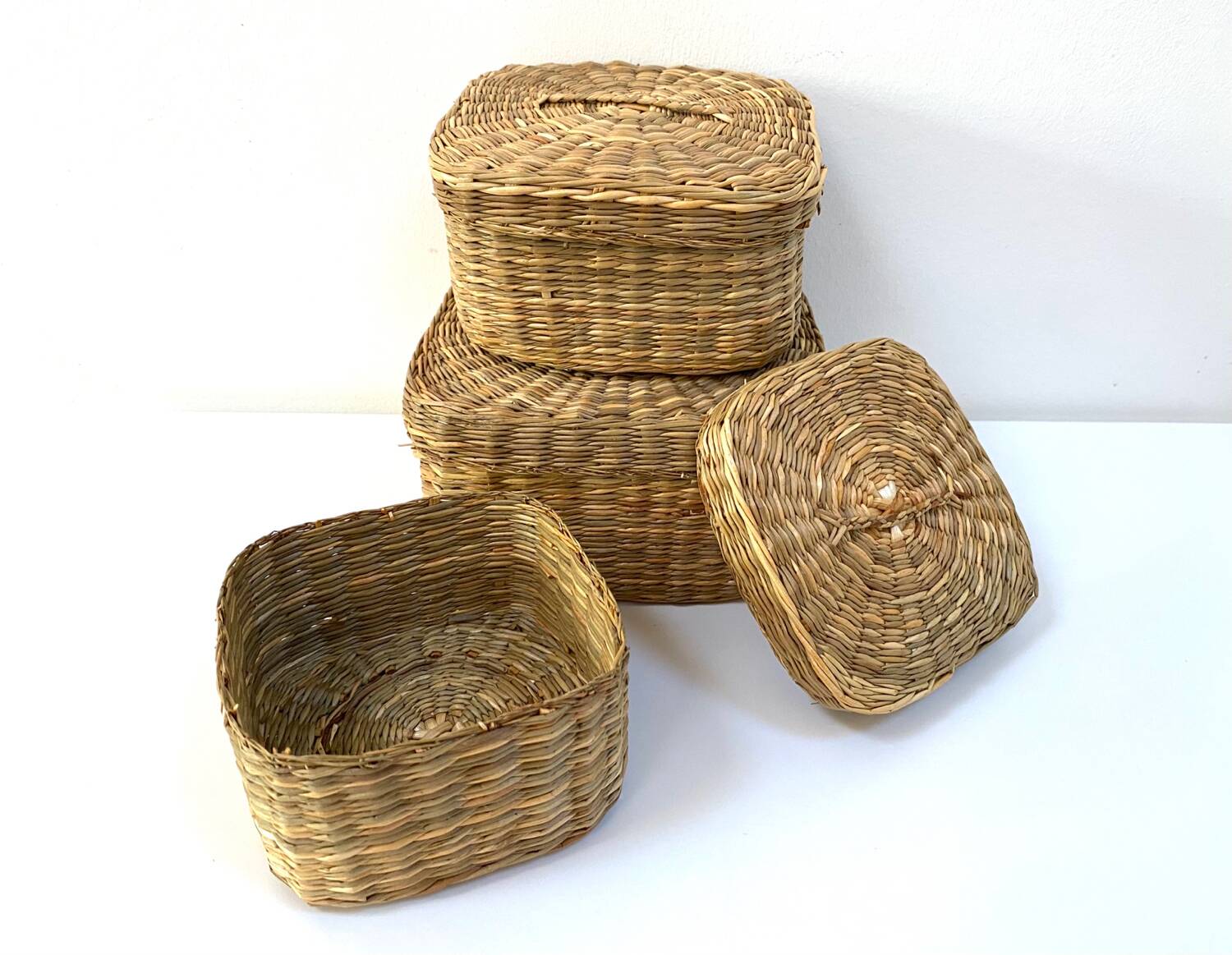 Vintage trio of small rattan nesting baskets