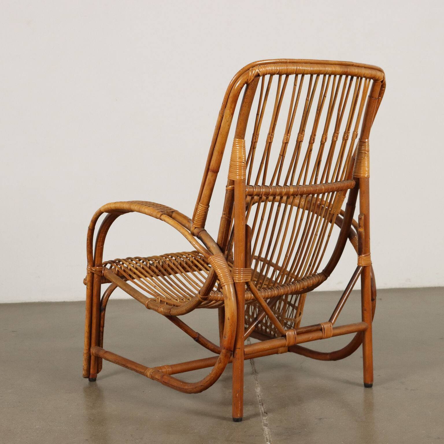 Vintage wicker armchair with magazine rack, Italy, 1960s