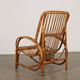Vintage wicker armchair with magazine rack, Italy, 1960s