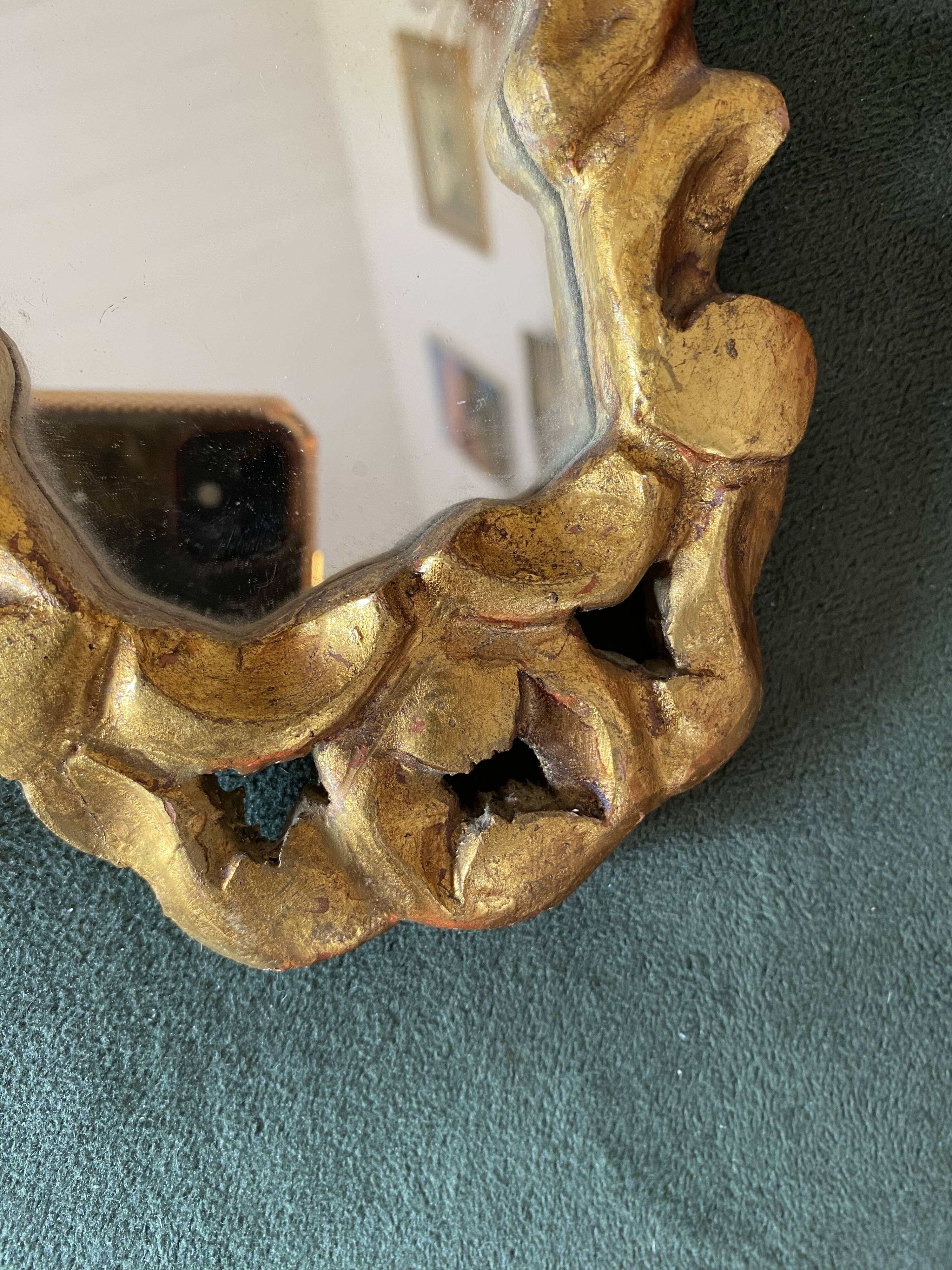 Small baroque gilded wood mirror.