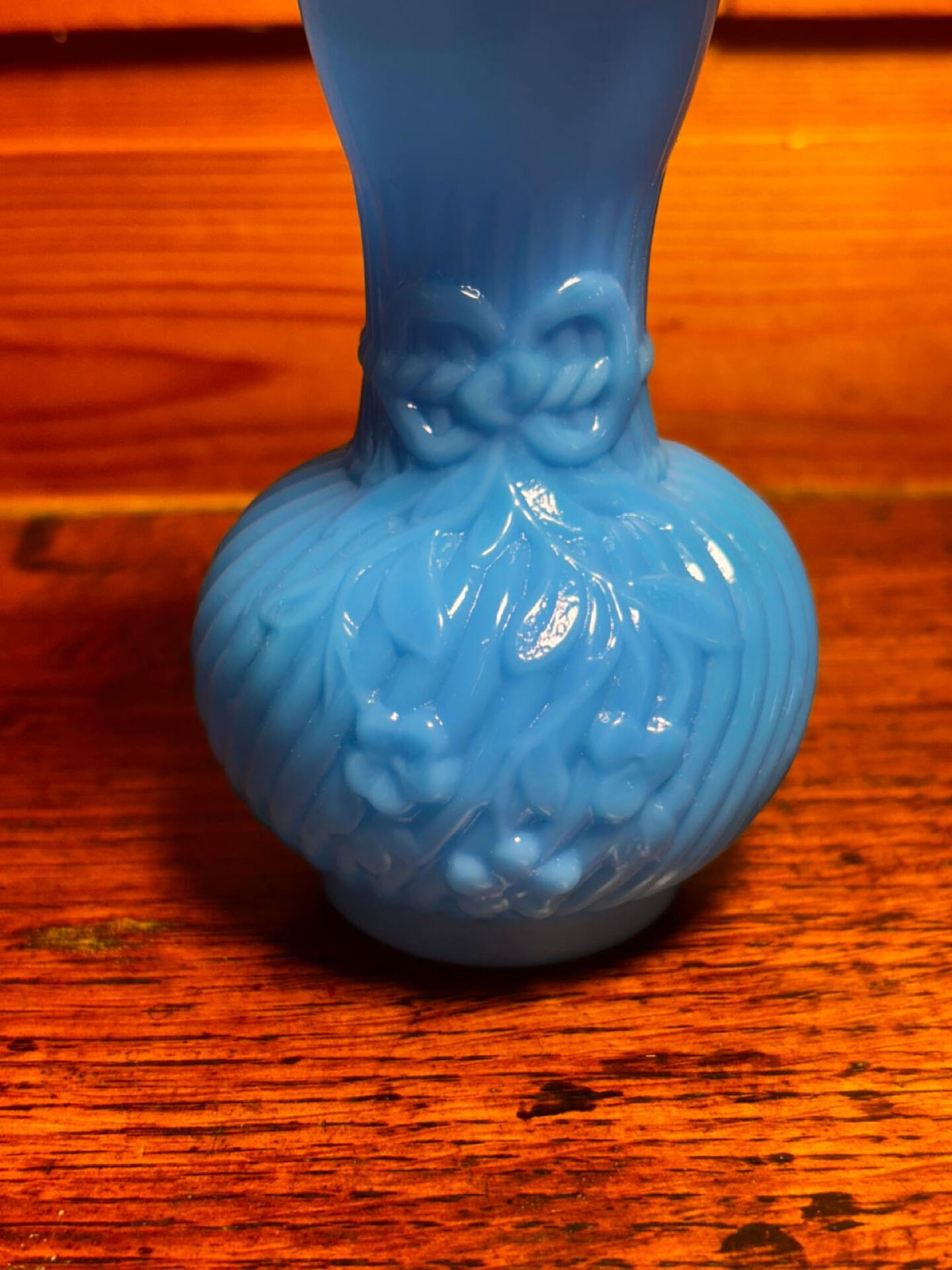 Blue opaline vase, opaque glass, wavy neck/rim, relief decoration of a bow.