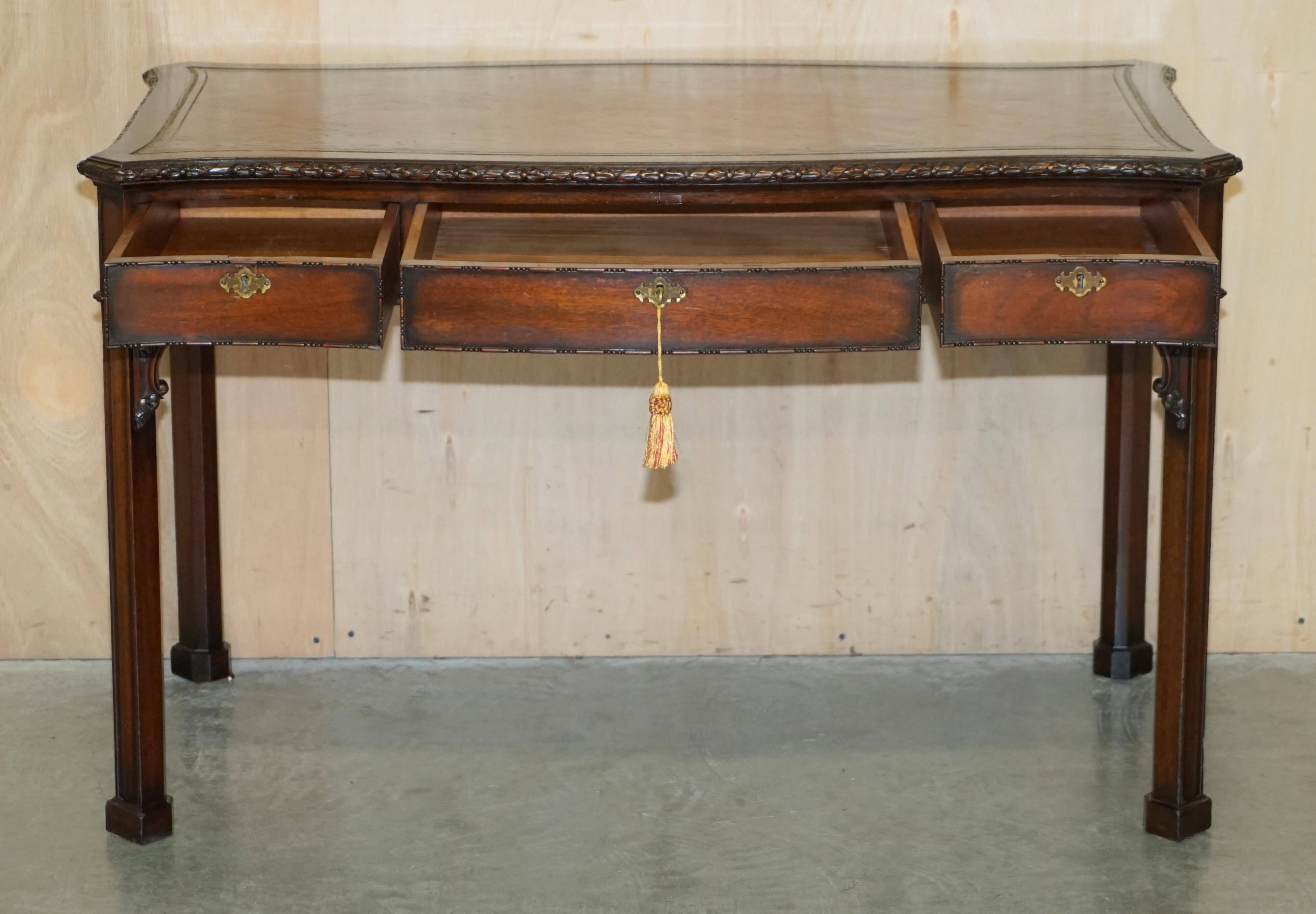 WARING & GILLOW library desk in the style of Thomas Chippendale with a leather top.