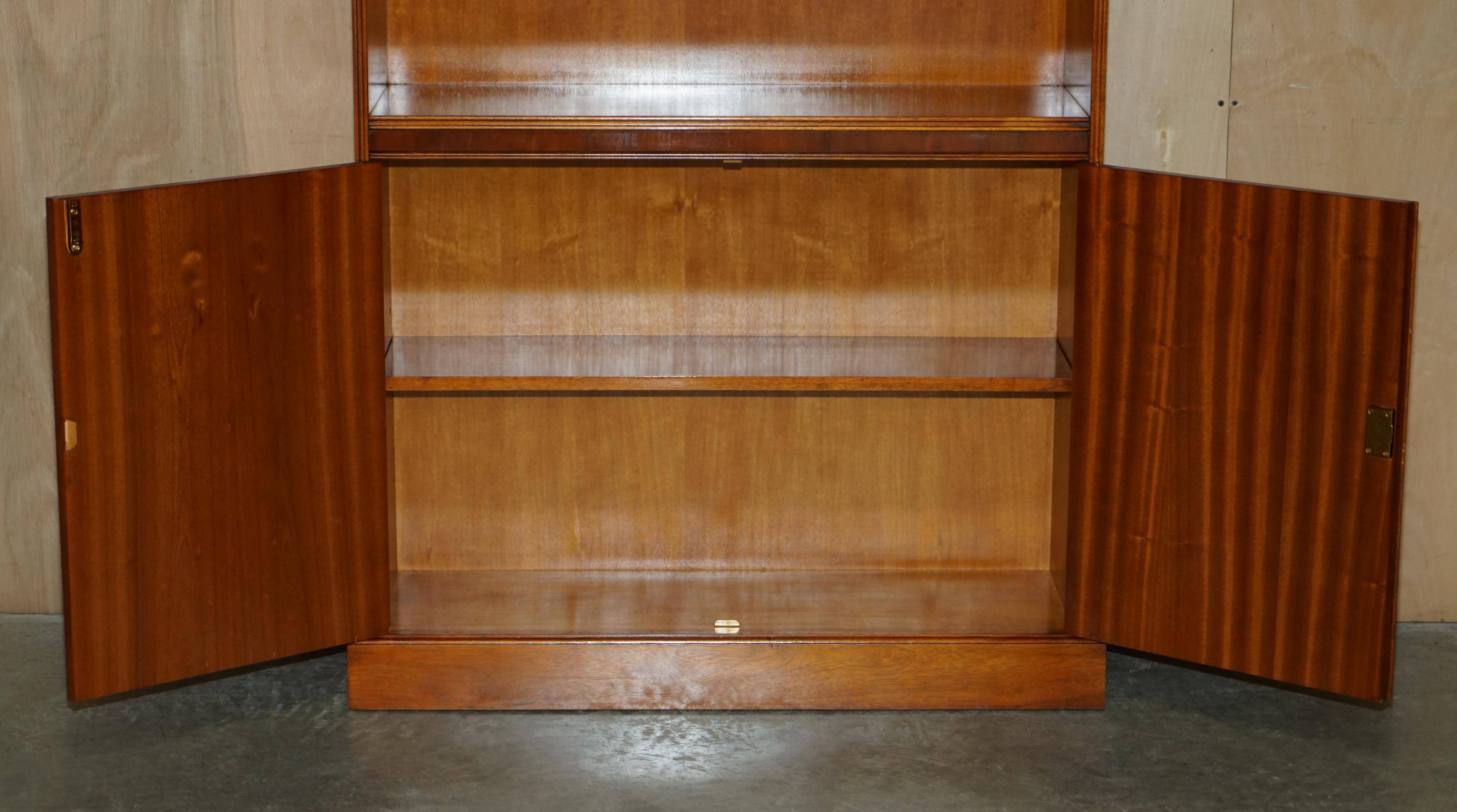 Open library Bradley Furniture made of yew wood with a cupboard base.